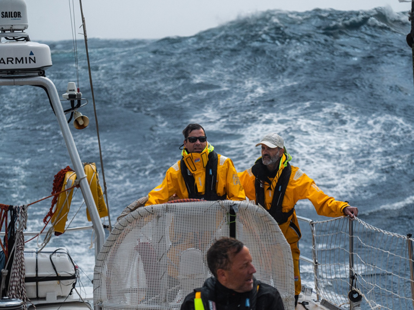 Sailors aboard yachts during Clipper race in high seas
