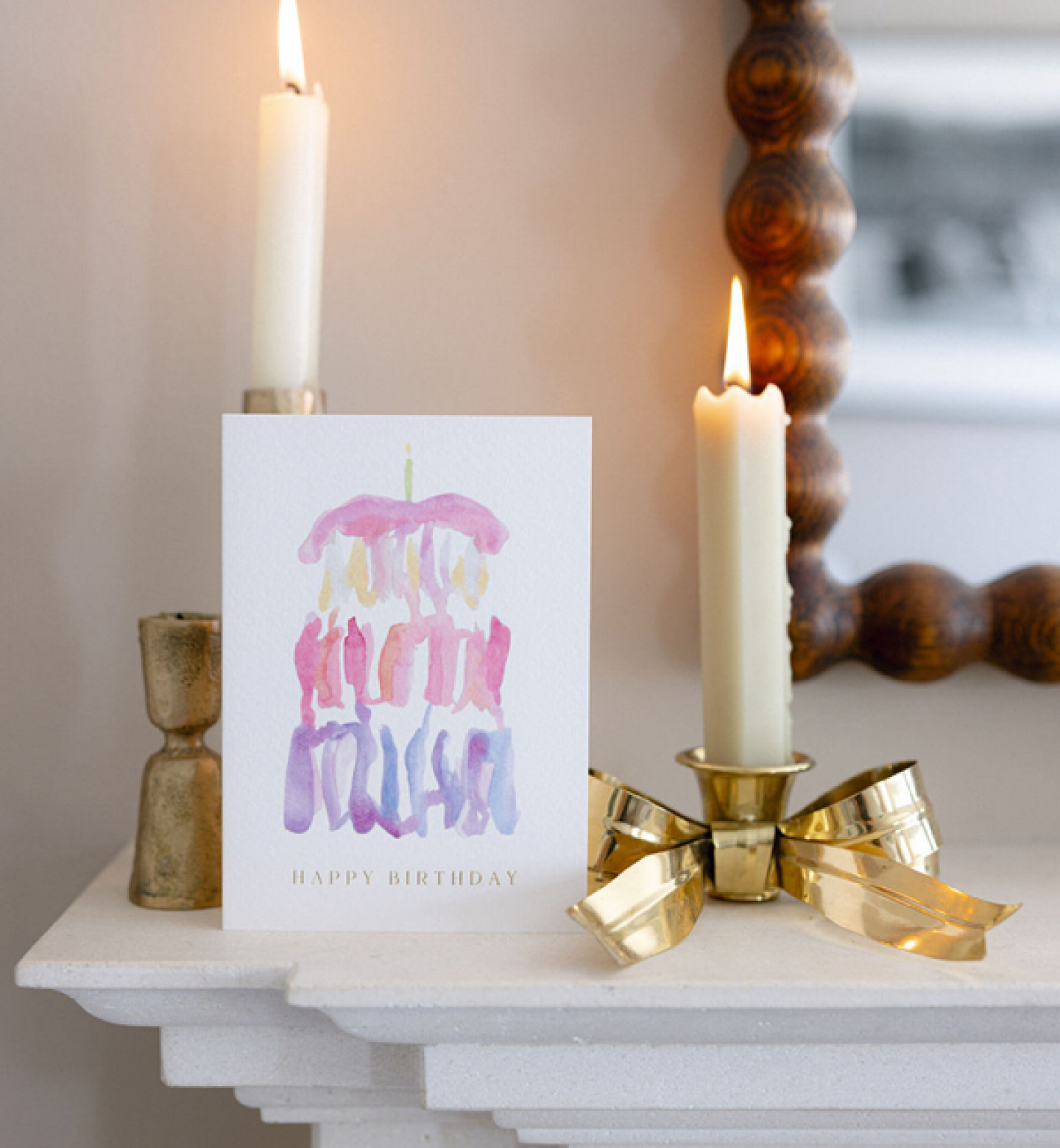 birthday cake watercolour card with bow candles on a fire place