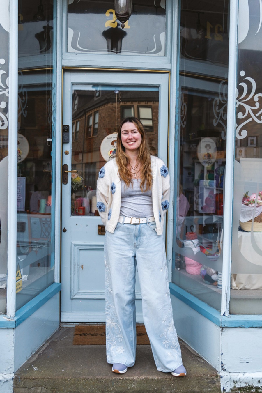 lady in front of her shop