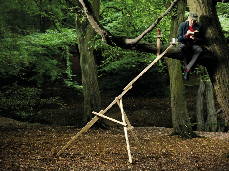 Dominic Wilcox sitting in a tree