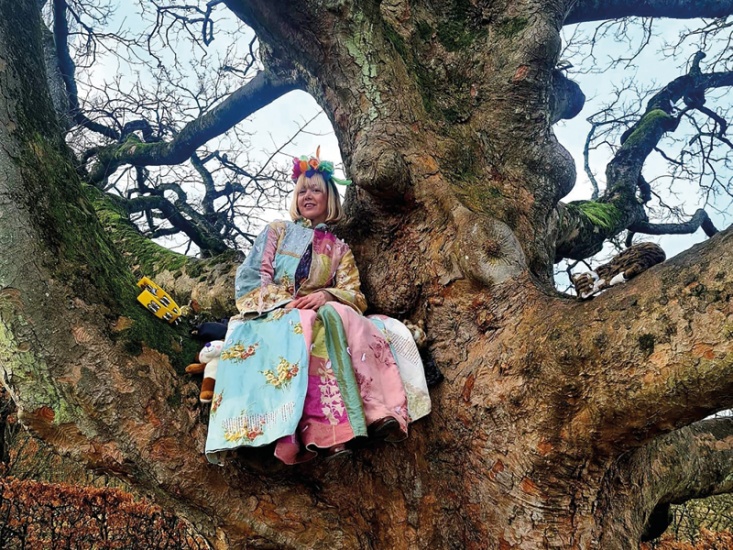 woman sat in a tree