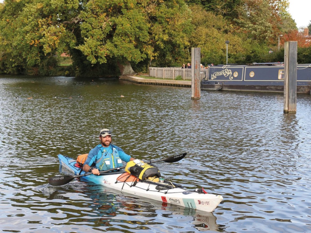 Dan paddling in his canoe