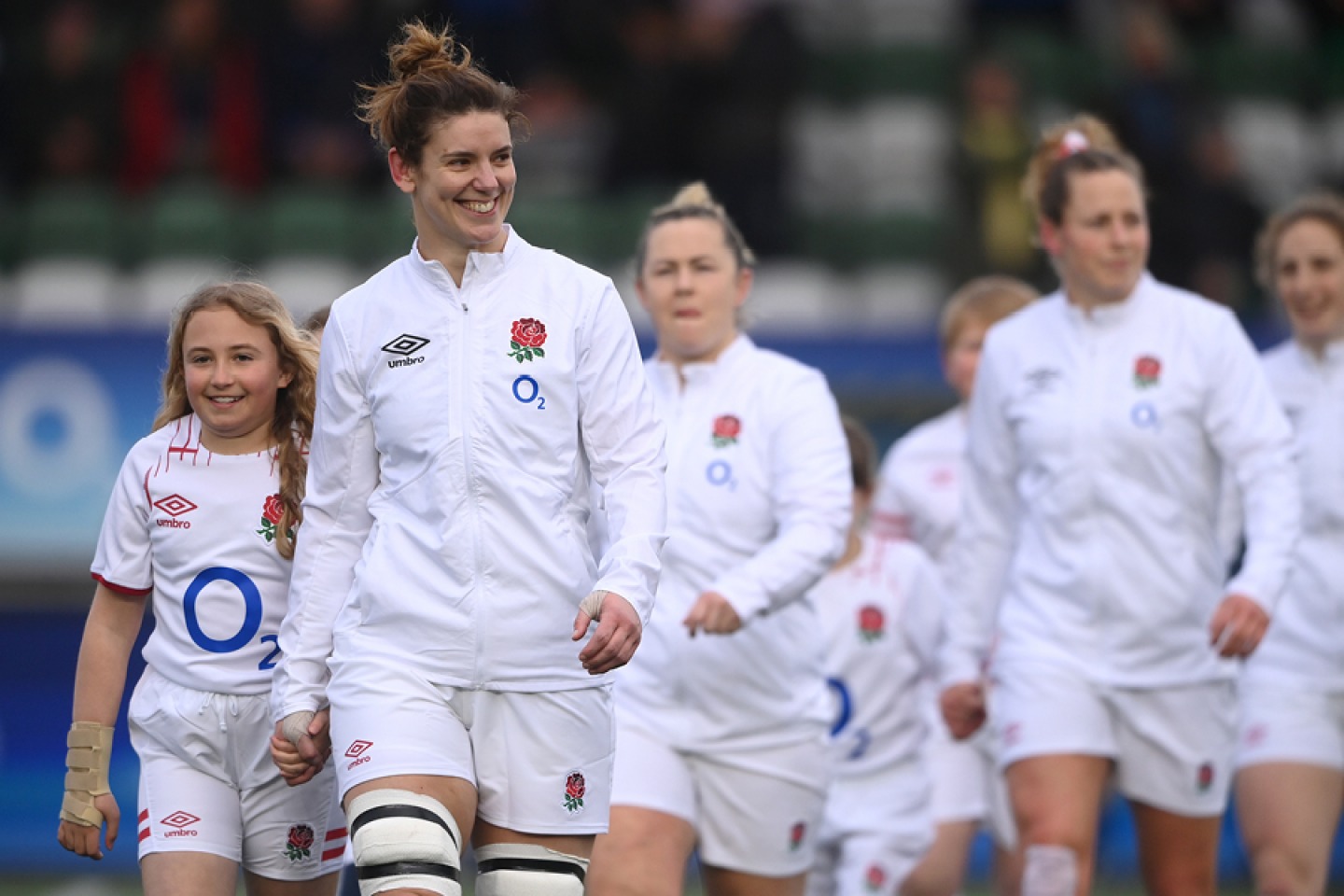 Sarah walking onto the field with her team mates