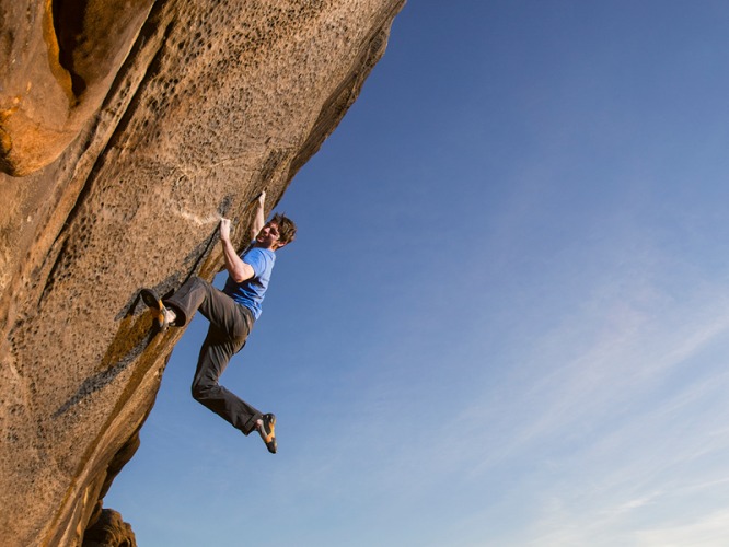 Man free climbing on a rock face