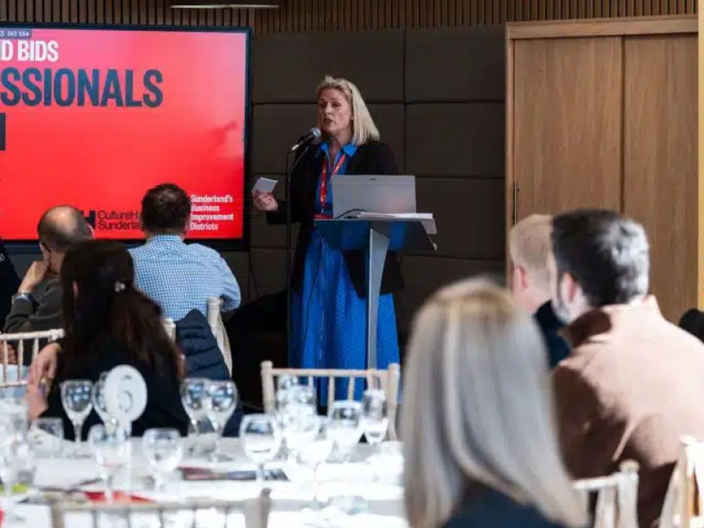 Sharon speaking at a lunch conference