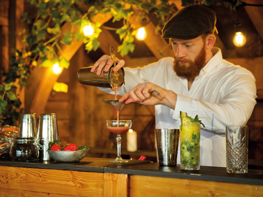 barman making cocktails