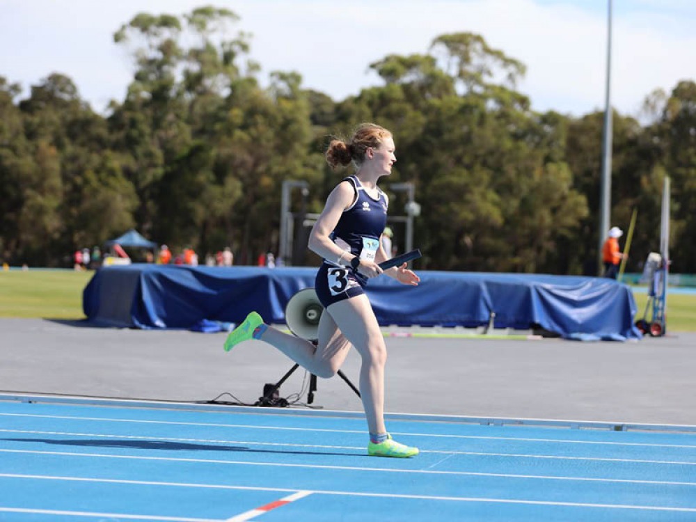 Charlotte running a relay competition