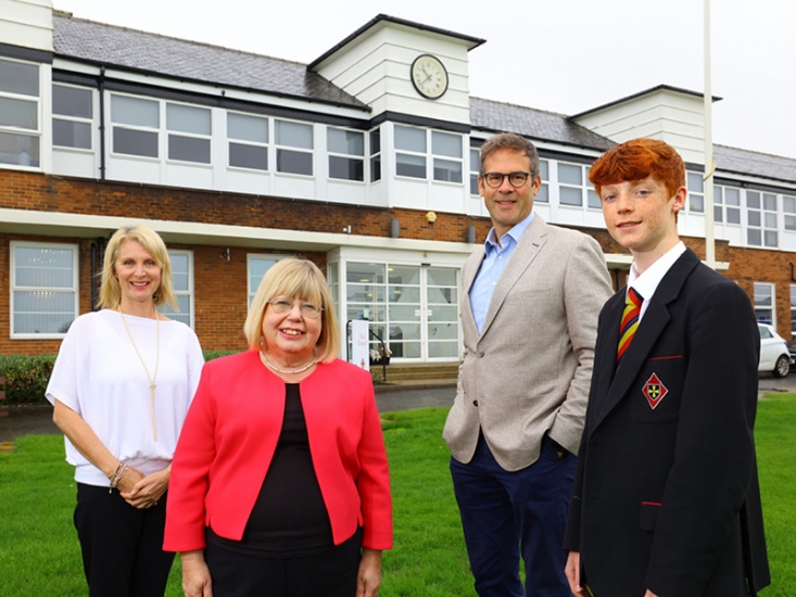 Teachers, a pupil and MP Liz Twist outside school