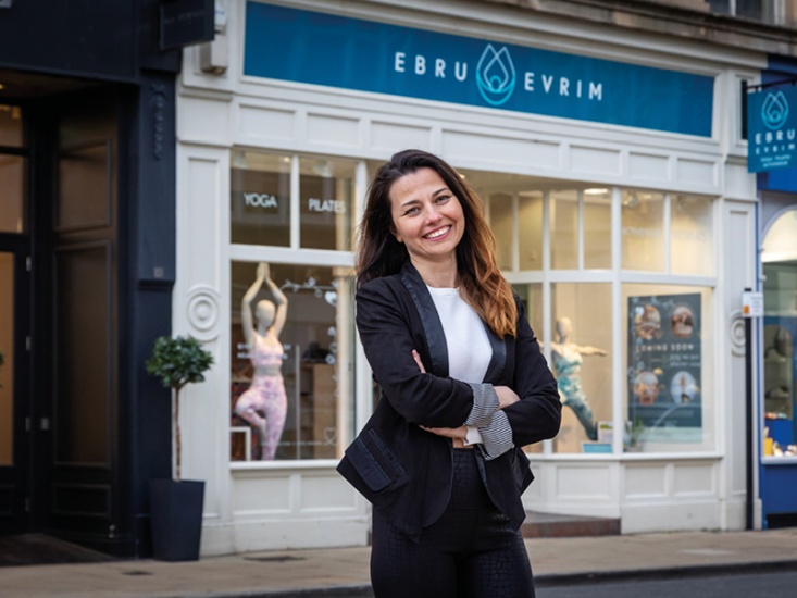 lady smiling outside a shop