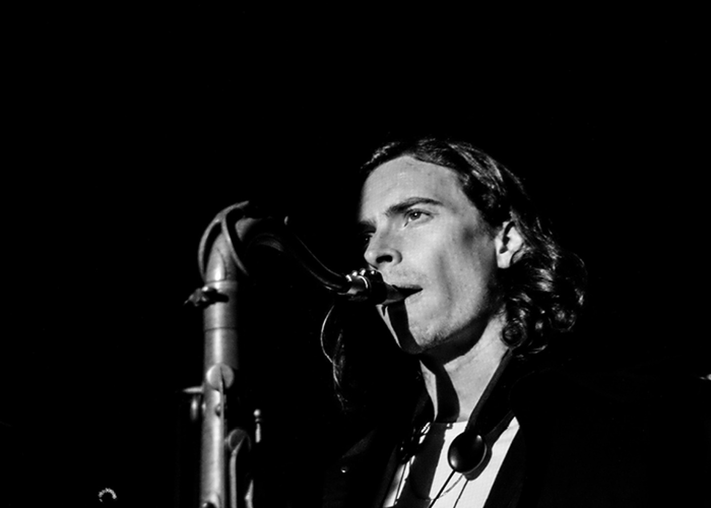 black and white photo of John playing Sax