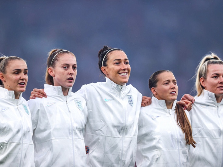 Lucy Bronze along side players before match