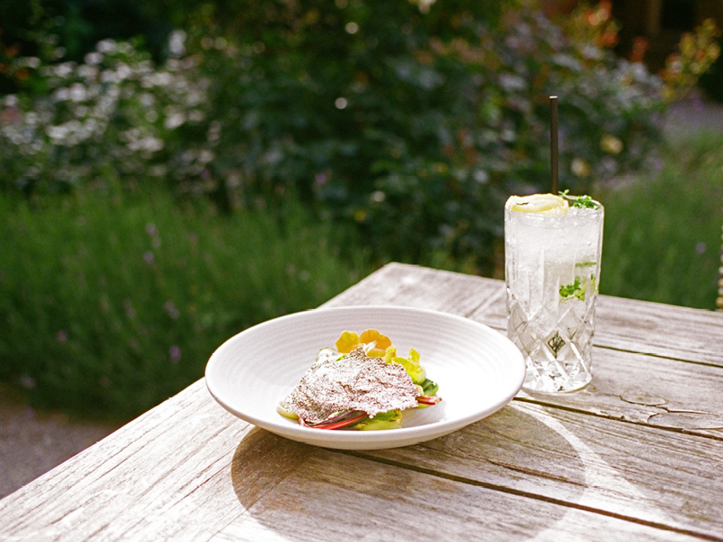 salad and drink on outside table