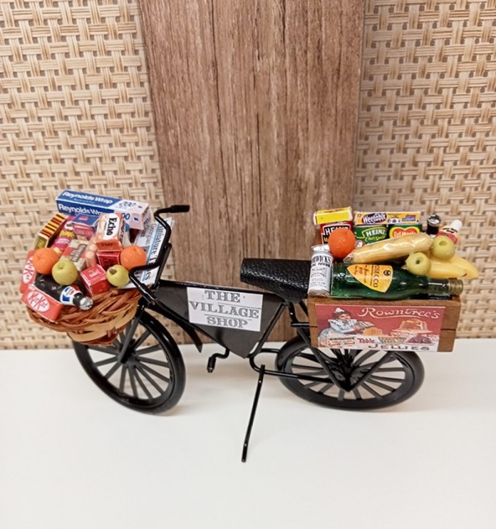 Model of Miniature bike with baskets contains food and drink