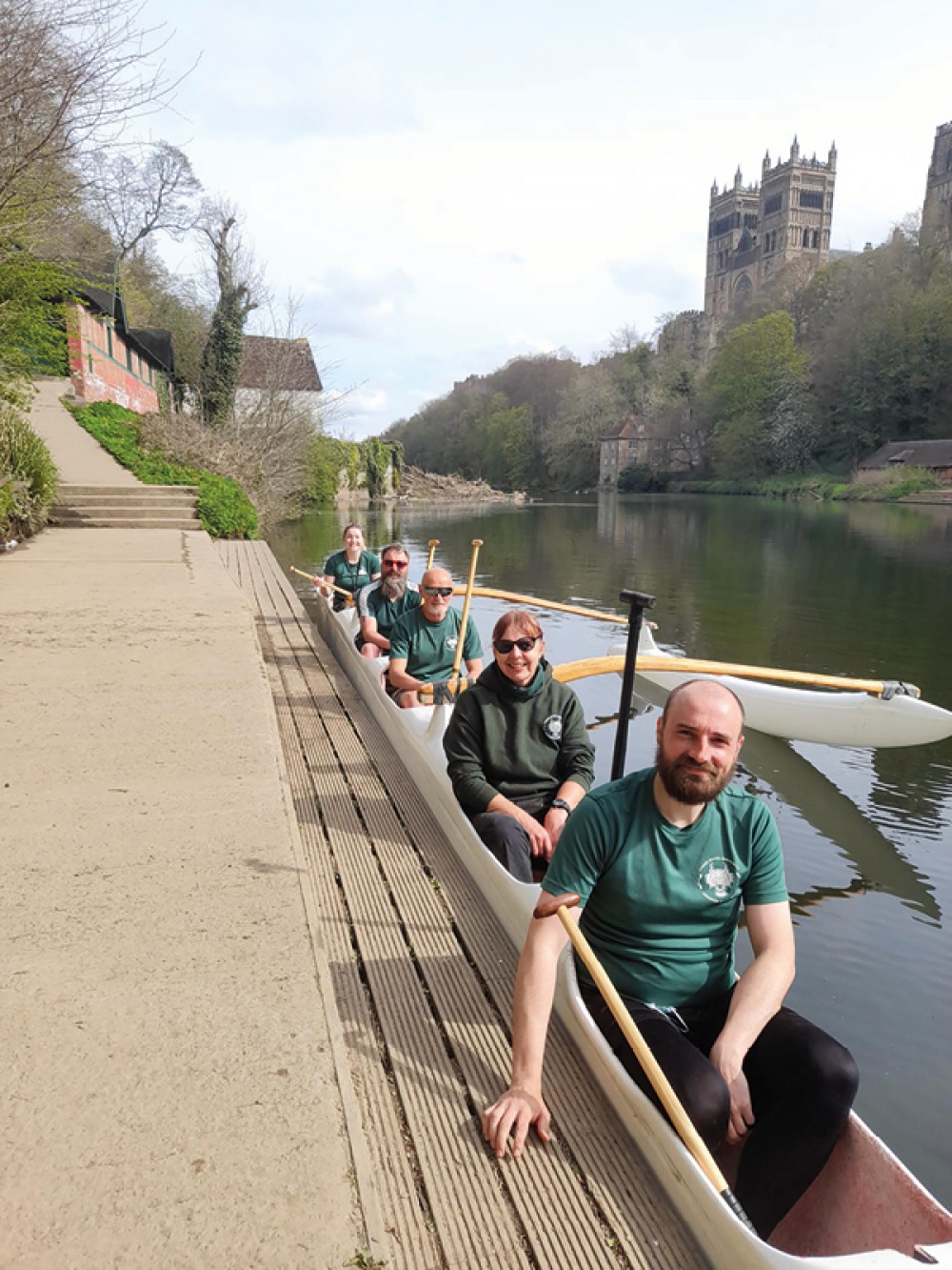 rowers sat in their long boat