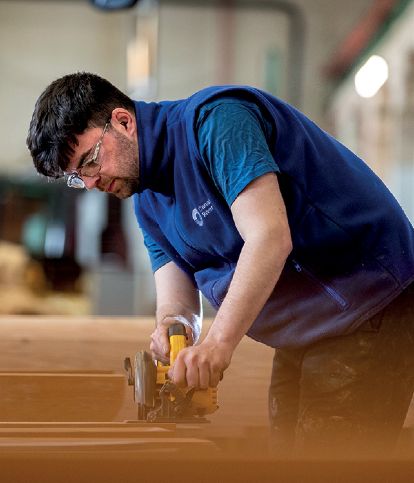 man working with machinery on the gates