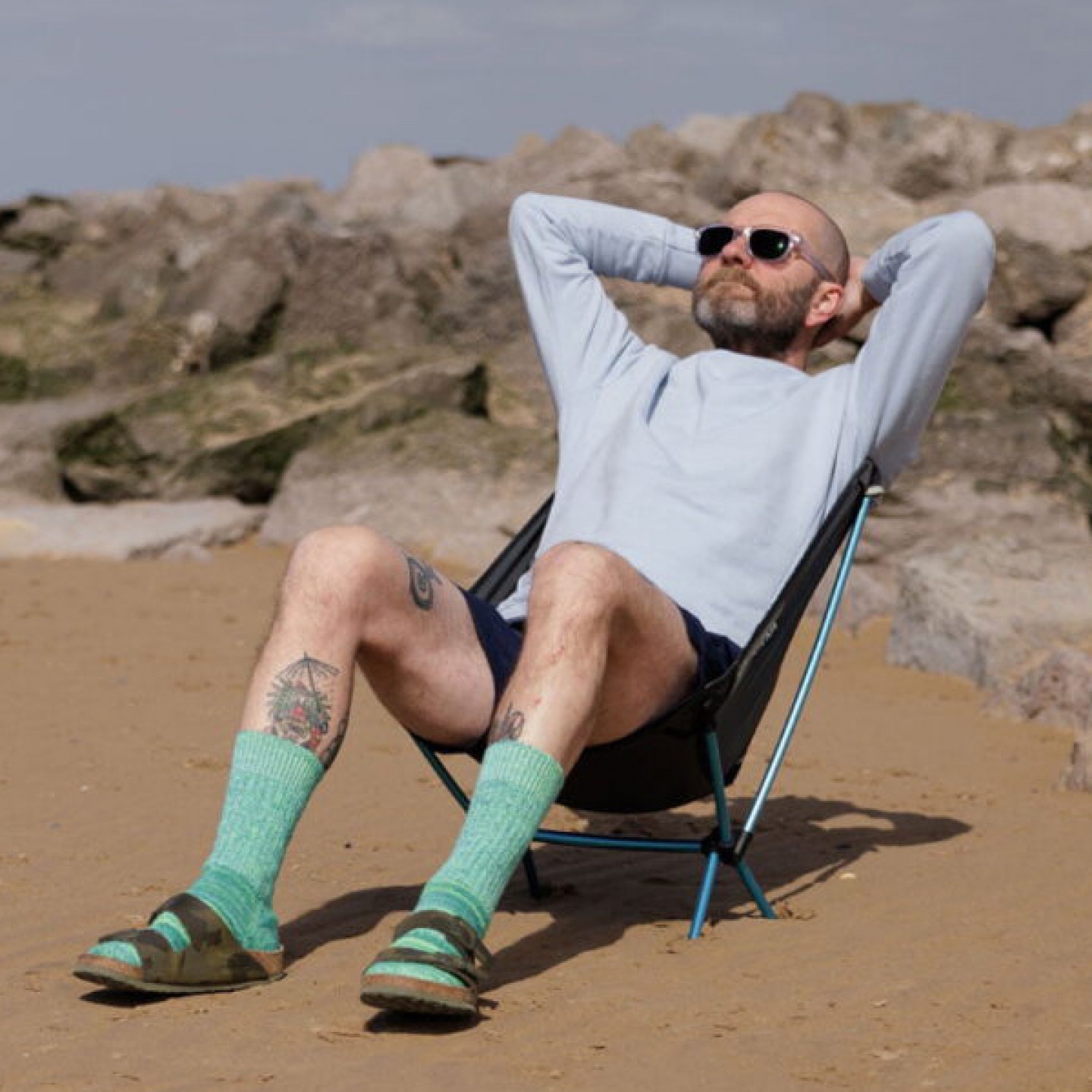 man sitting on a deck chair