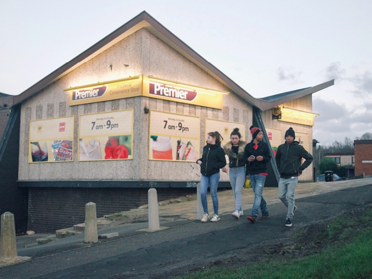 4 black children walking in their home town