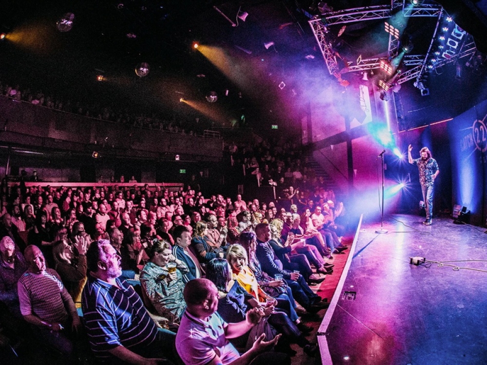 man on stage with audience