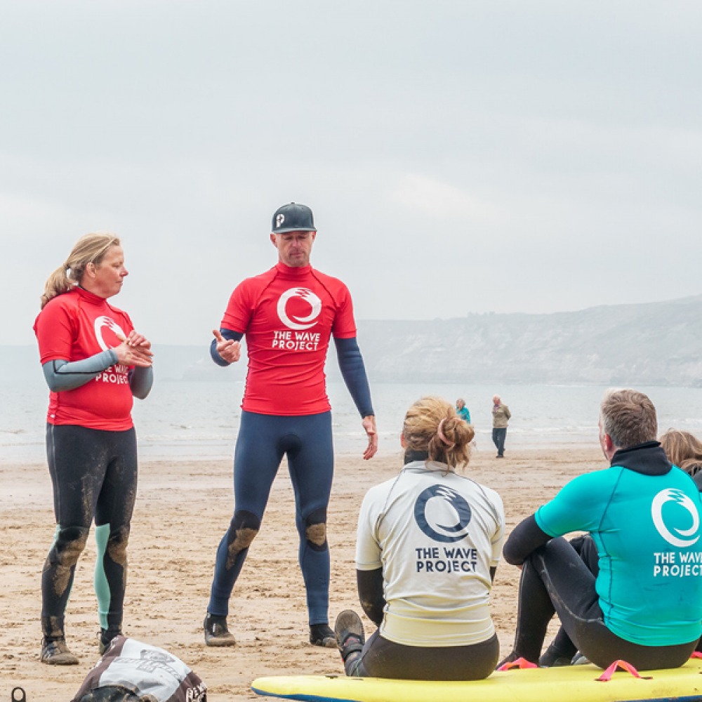 instructor teach surfing on land