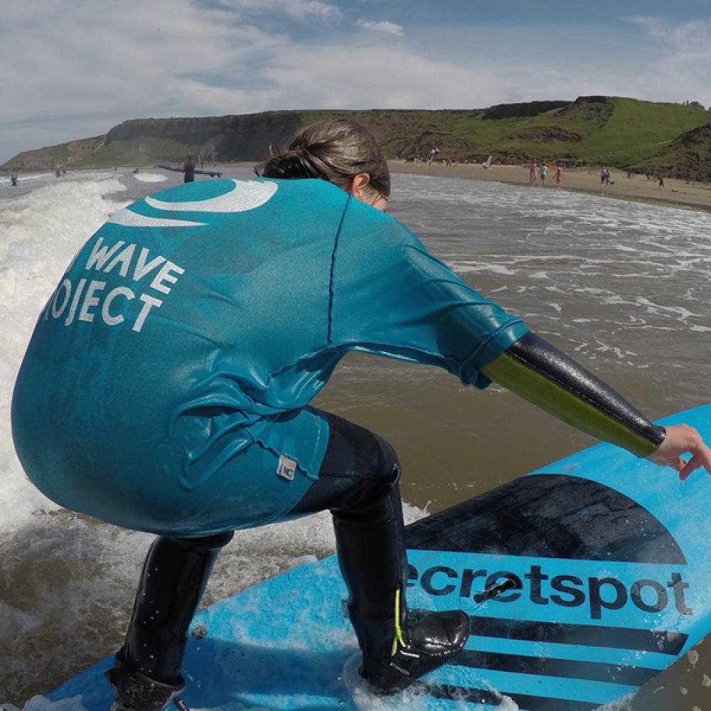 child learning to surf