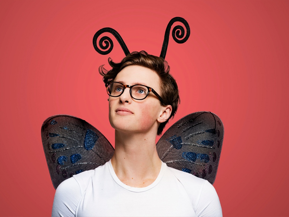 guy dressed in fancy dress butterfly wings