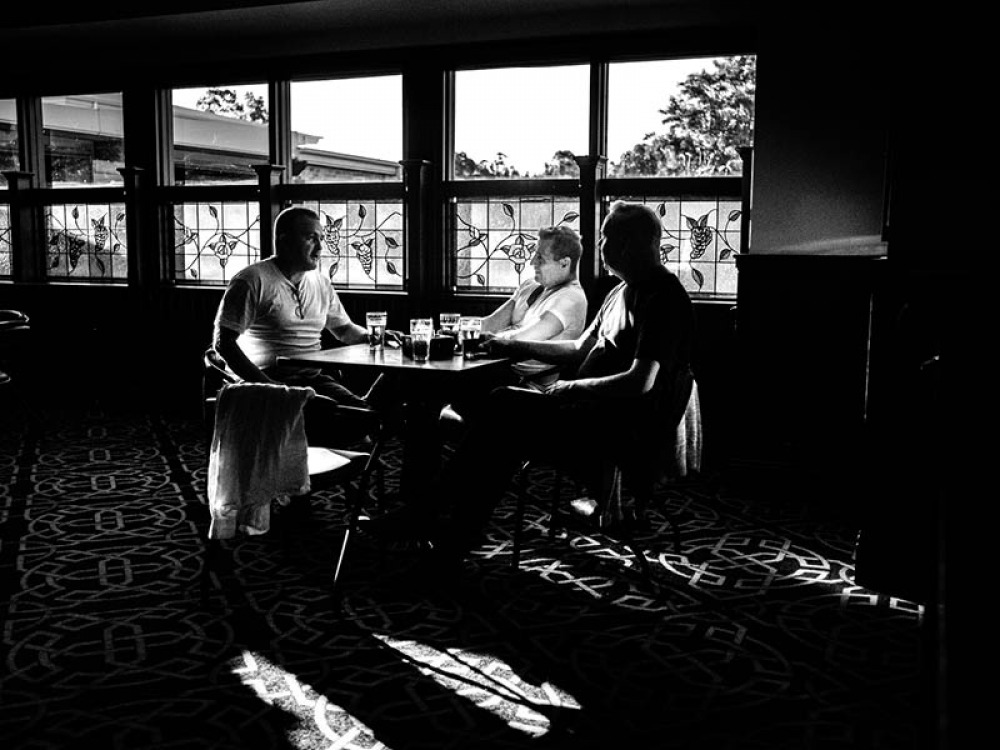 men drinking in a pub