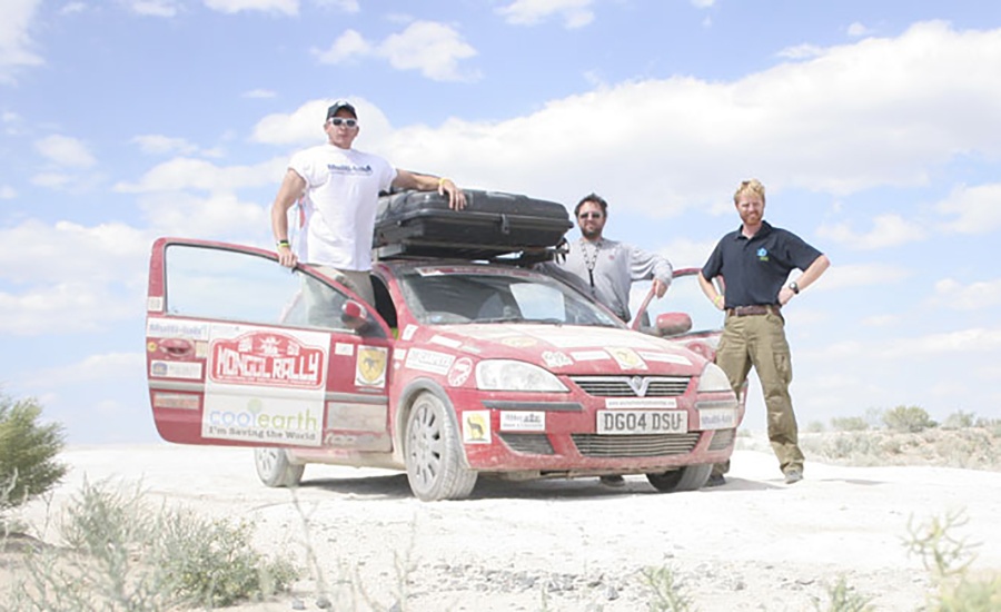 Three men with a Vauxhall Corsa