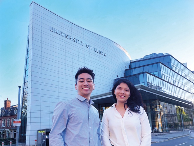 Saile Villegas and colleague standing in front of Leeds Uni building