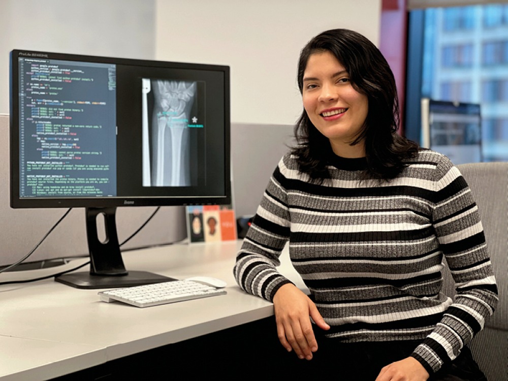 Saile Villegas sat in front of computer