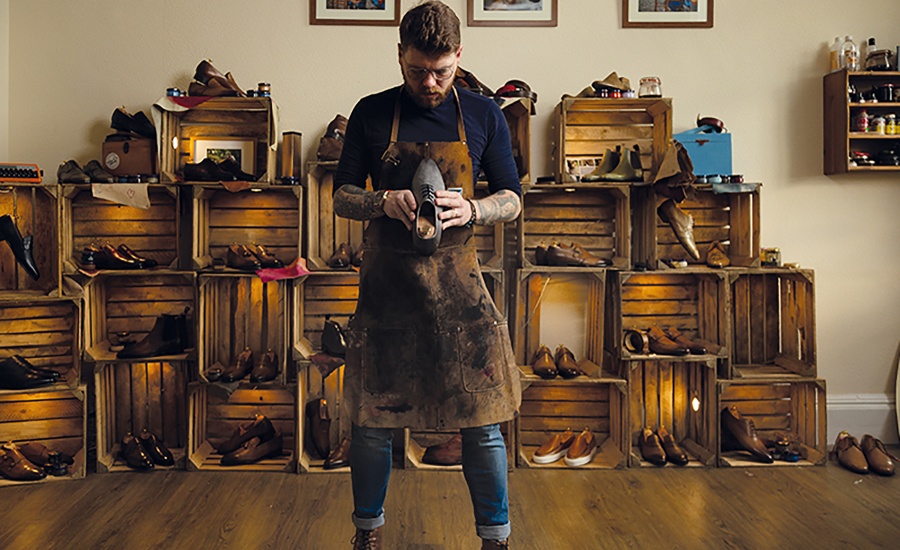 Simon Bourne holding a shoe