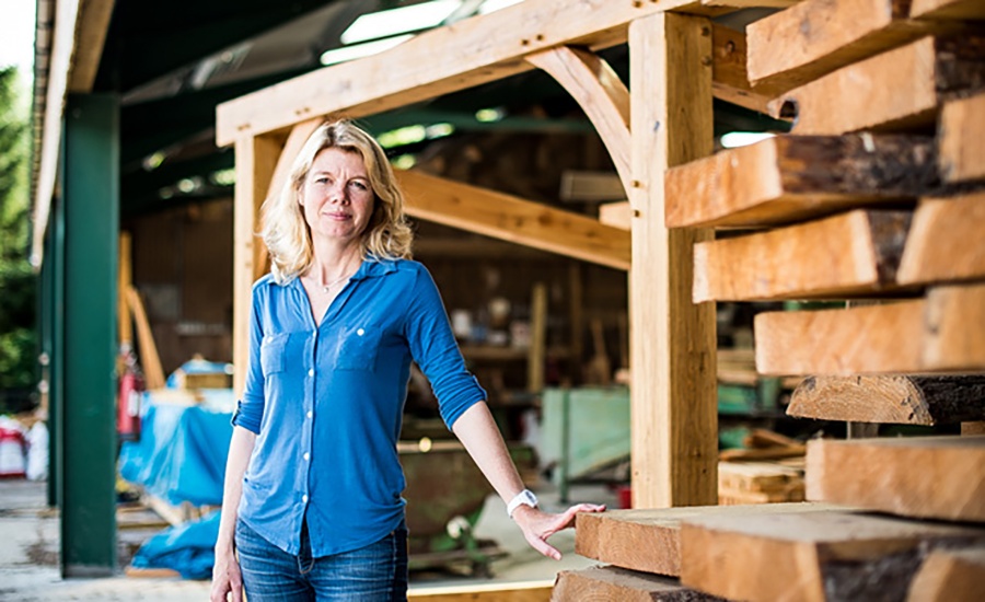 Emma Woods standing outside her sawmill