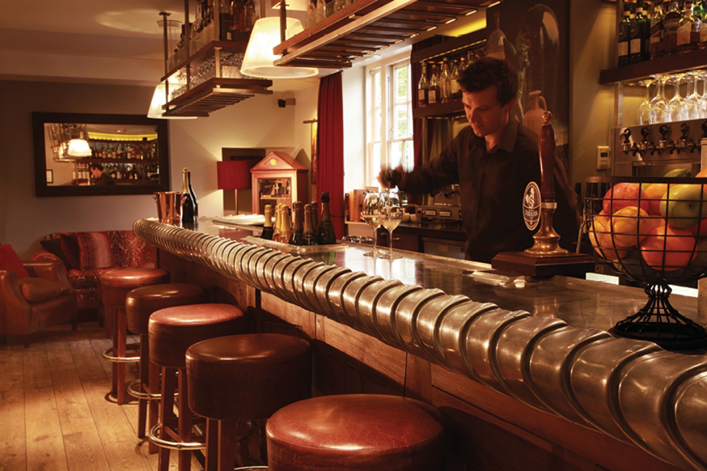 Barman pouring wine