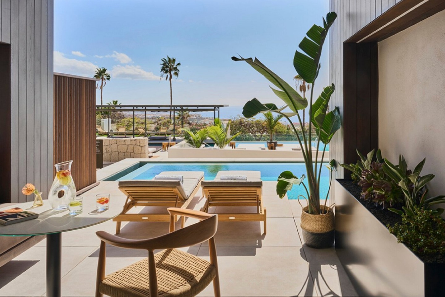 sun loungers leading to private swim up pool