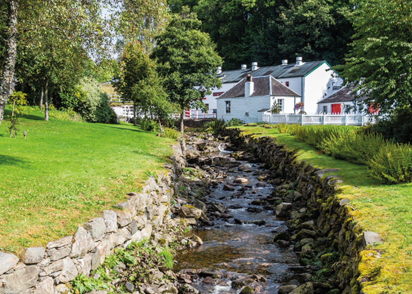 Running Brook with a White House in background