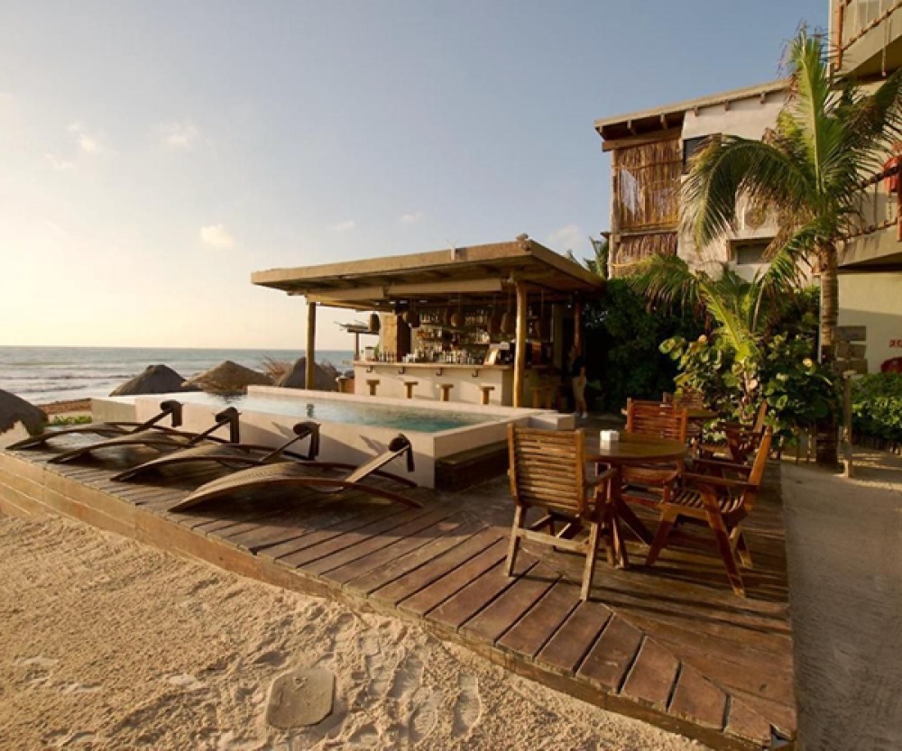 Beach bar with pool and loungers