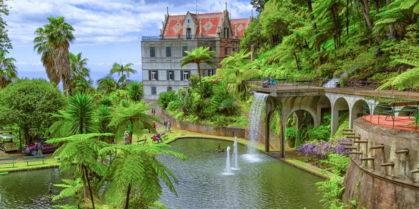 Monte Palace Gardens Lush, tropical gardens and waterfall with palace in the background