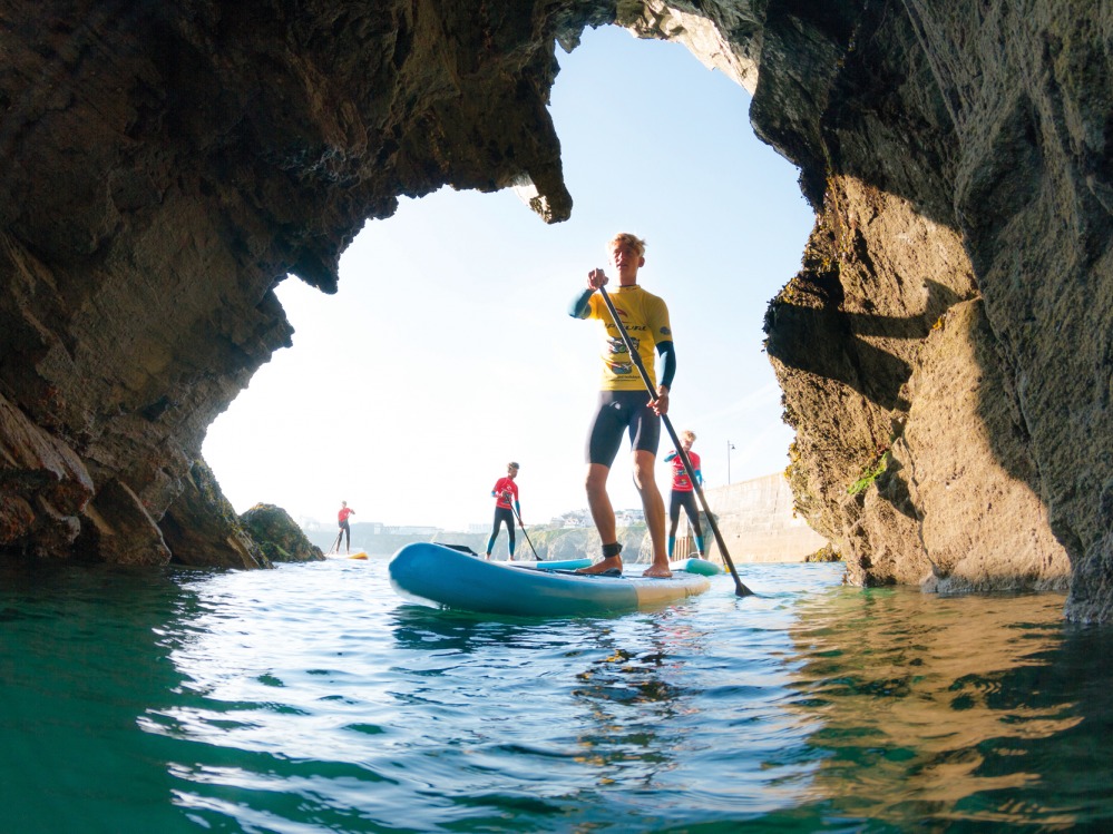 people stand up paddle boarding