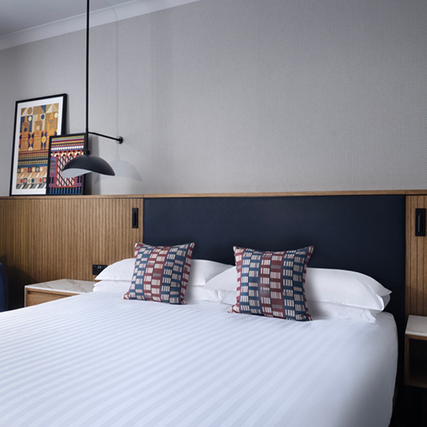 modern guest room with a double bed