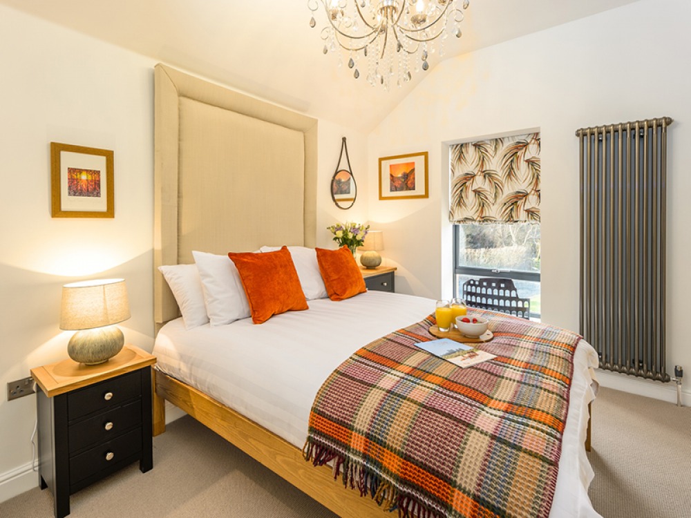 Modern Guest room, neutral with pops of orange colour