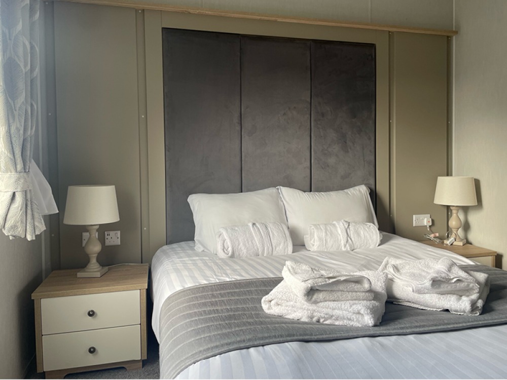 Bedroom with guest robes and towels