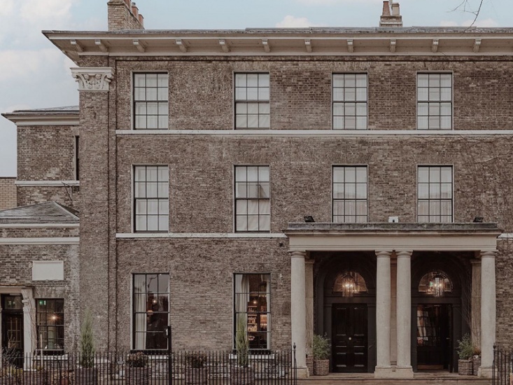 traditional brick building which is now a hotel
