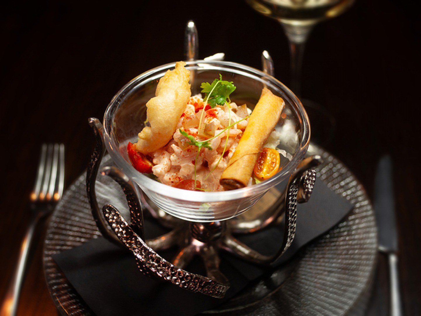 Prawn cocktail served in a glass and metal tentacle dish