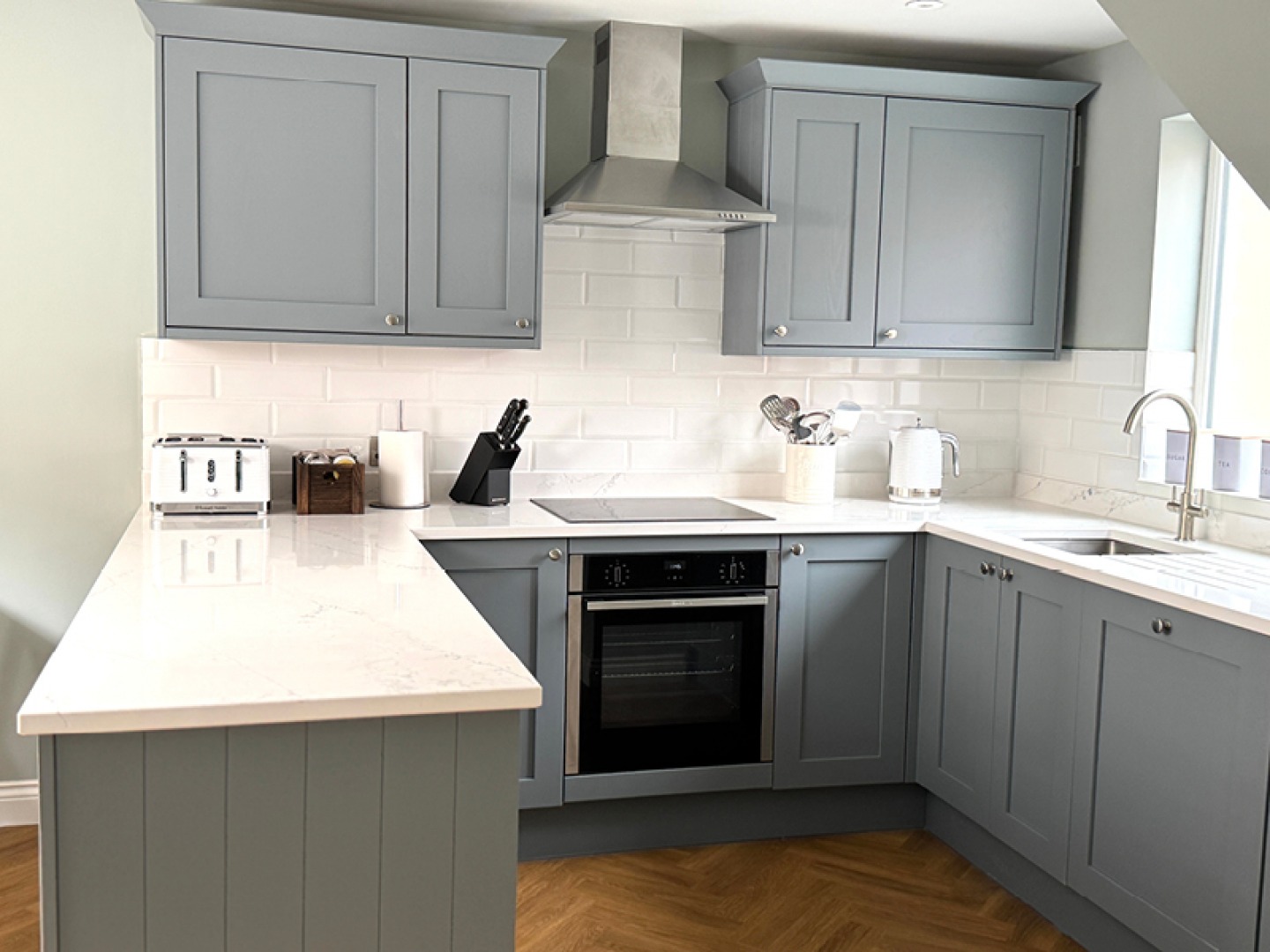 Modern shaker kitchen in grey with white counter tops