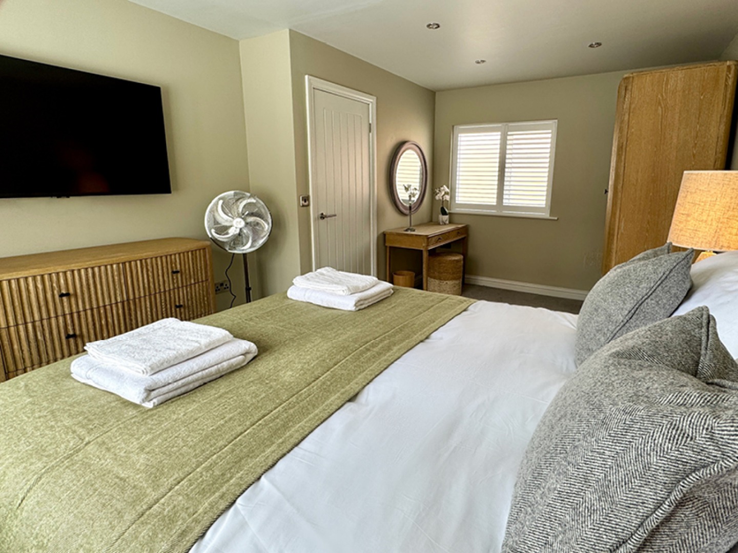 double bedroom decorated with light green and white