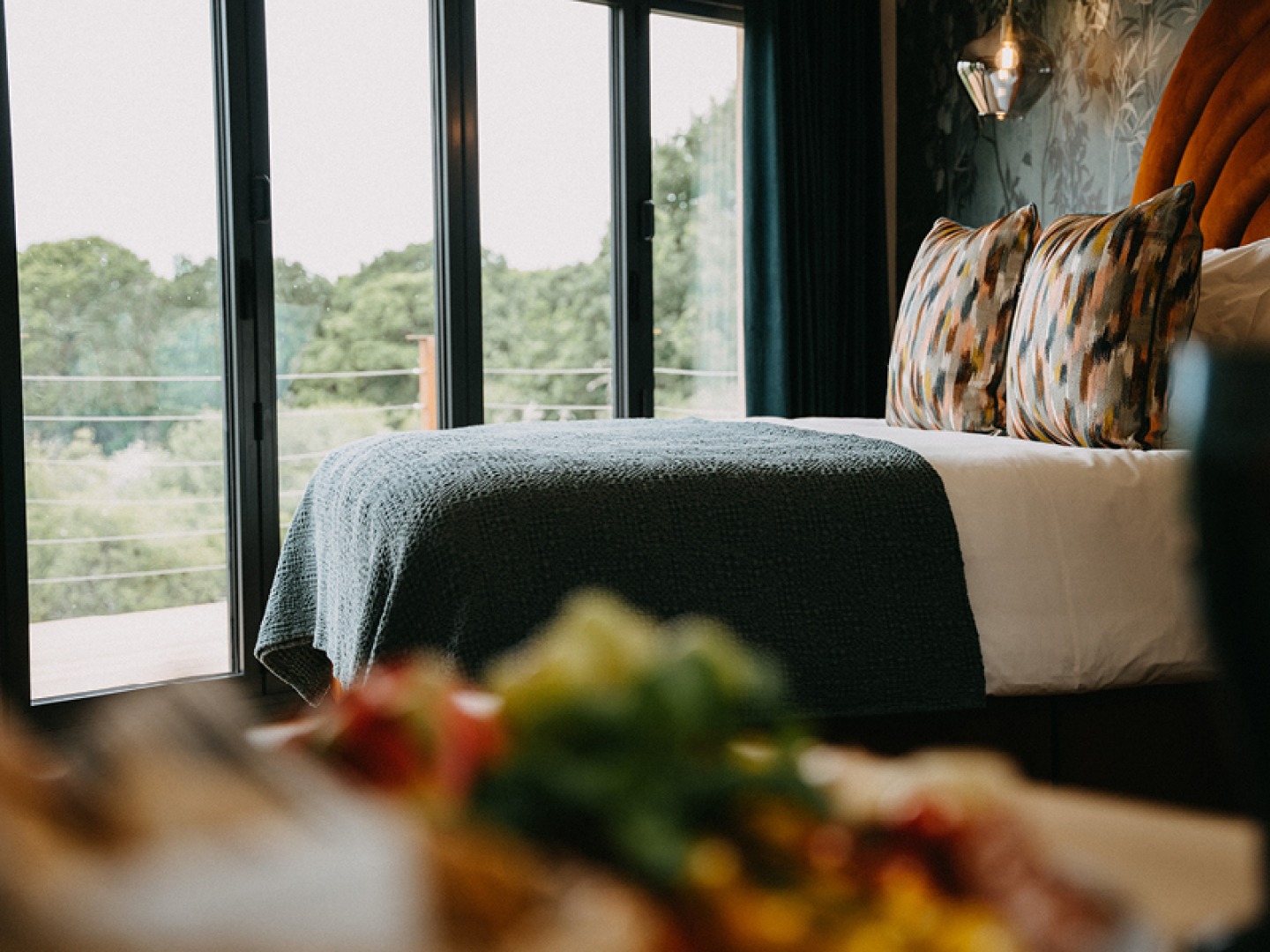 double bed with views out of bi-folding doors