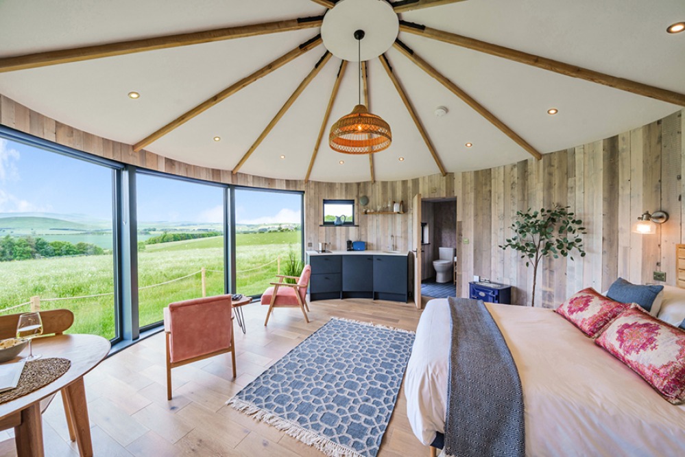 Scandi-inspired interior of a round glamping pod