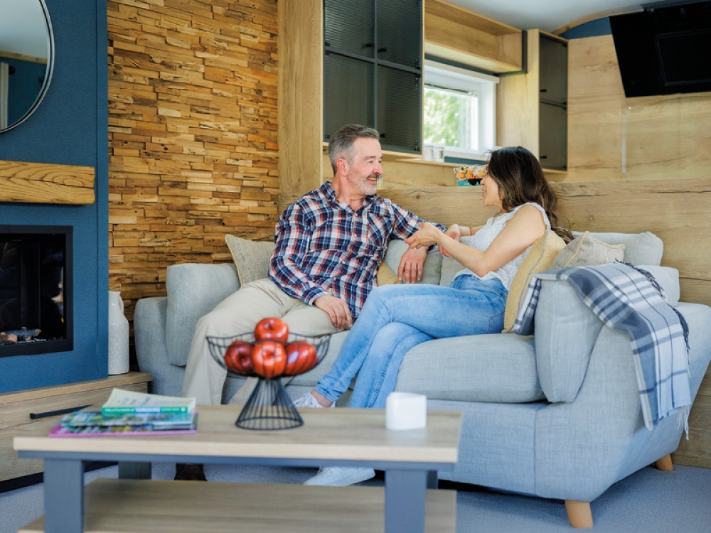 Couple sitting on a comfy sofa chatting