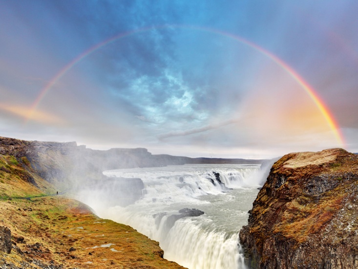 waterfall with a rainbow over the top