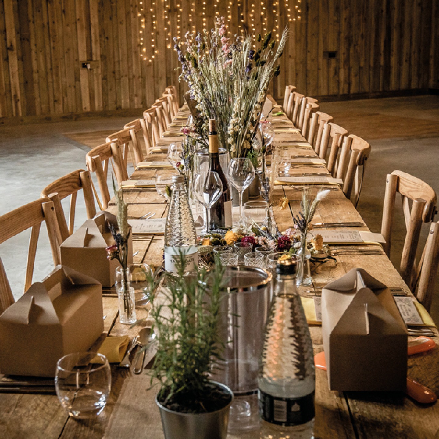 long rustic table set for wedding breakfast