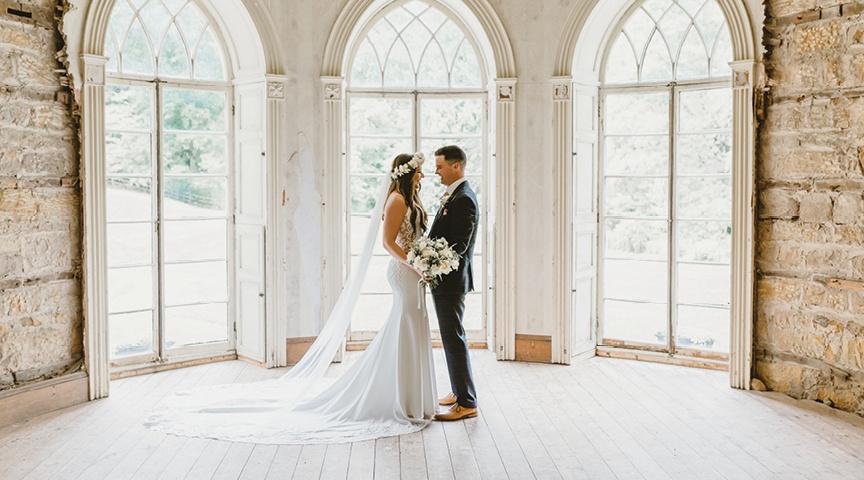 bride and groom gazing at reach other